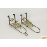 A pair of antique brass and steel adjustable heart