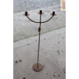 An iron three light candle stand