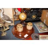 A circular mahogany tray; a pair of tobacco jars a