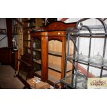 An Edwardian inlaid mahogany display cabinet