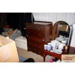 An oak chest of five drawers