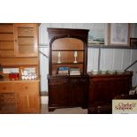 A small dark oak dresser