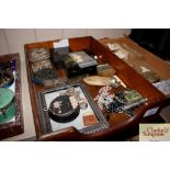 A wooden tray and contents including a Sovereign p