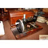 A walnut cased New Brunswick sewing machine