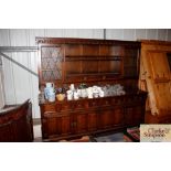 An oak linen fold panel dresser