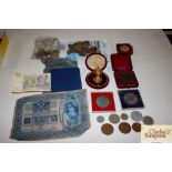 A bag of miscellaneous coins, medallions and medal