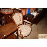 A Victorian carved walnut armchair