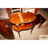 A mahogany two tier kidney shaped occasional table