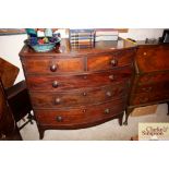 A Georgian mahogany bow fronted chest of two short