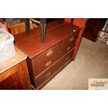 An Edwardian chest of two short and two long drawe