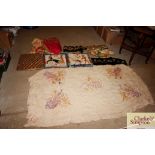 A collection of various table covers; decorative t