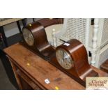 An oak cased two hole mantel clock together with a
