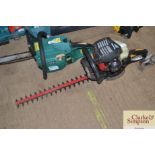 A Homelite petrol hedge trimmer