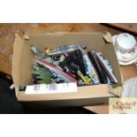 A box of military diecast planes and ships