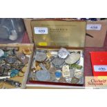 A Craven A tin containing various medallions and b