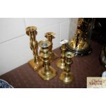 Five antique brass candlesticks
