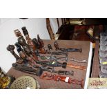 A collection of ebony and hardwood carved ethnic f