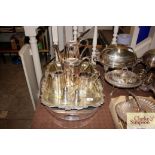 A four piece plated tea set; a similar tea tray AF; an