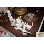 Two Lladro ware goose groups; a Royal Copenhagen group of goats; and a Nao ware figure of a girl