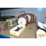 An Art Deco style timepiece; an alarm clock and an