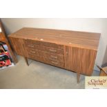 A wood effect side board, fitted four central draw