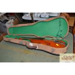 A violin in fitted carry case (lacking bow)