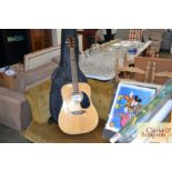 A Westfield acoustic guitar with carry case and tw