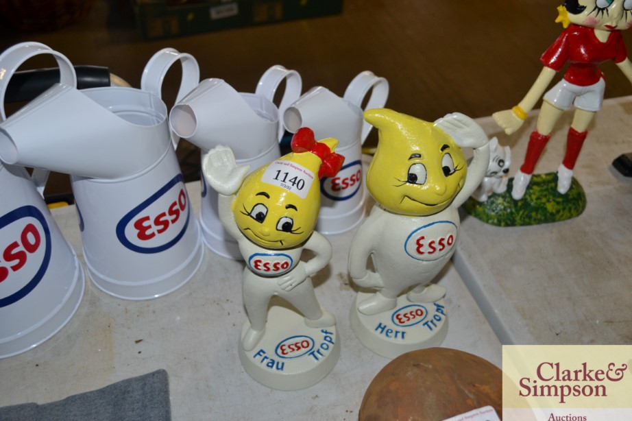 A pair of reproduction Esso money banks