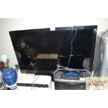 A Sony Bravia flat screen television with remote c