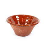 A brown glazed earthenware dairy bowl, 43m dia.