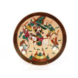 A Chinese crackle glazed shallow dish, decorated warriors in brightly coloured enamels, seal mark to