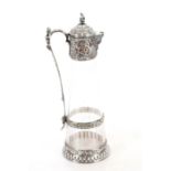 A Victorian electroplated German claret jug, of tapering form, the glass body finely etched with