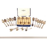 A cased set of six silver teaspoons, and a collection of various silver teaspoons and condiment