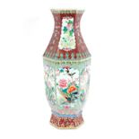 A Canton baluster vase, profusely decorated birds and flowers, 63cm