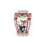 A Chinese baluster jar, having loop handles, brightly coloured enamel decoration of foliage, 33cm