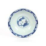 An 18th Century Chinese porcelain blue and white footed shallow bowl, finely decorated with