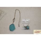 A white metal and Turquoise stone necklace and a similar bead