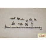 A silver 925 mark linked bracelet and ten charms