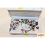 A quantity of Love Links bracelets charms and bead