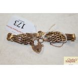 A 9ct gold bracelet with padlock clasp, approx. 12