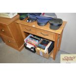 A modern light oak hall table fitted two drawers