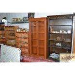 A mahogany effect and glazed display cabinet