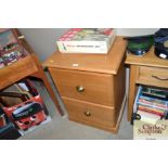 A modern pine filing chest, fitted two drawers