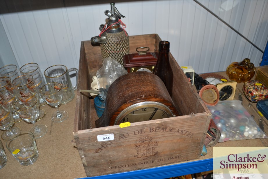 A wooden wine box containing soda syphon, oak two