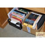 Two boxes containing various books including cooke