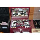A jewellery box and contents to include silver cur
