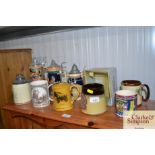 A collection of tankards to include Wade example a