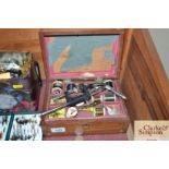 A box containing fly tying equipment and vice