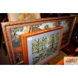 A pair of framed embroideries of rural scenes and