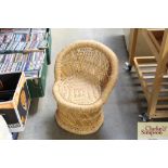 a small child's bamboo and raffia chair